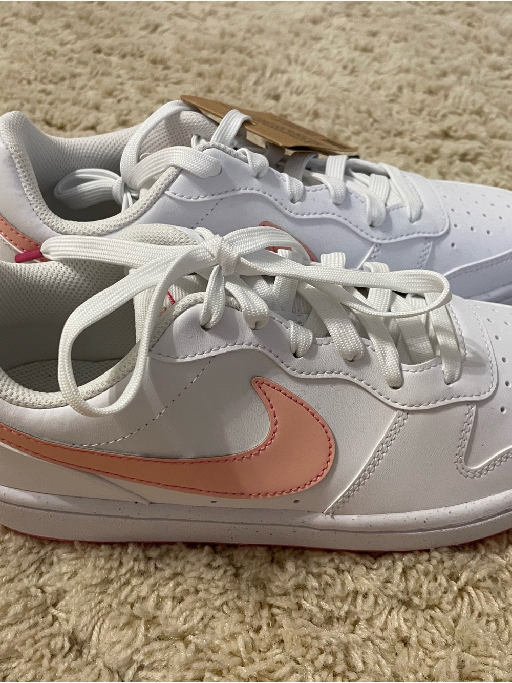 Nike Kids White Sneakers with Peach Pink Swoosh